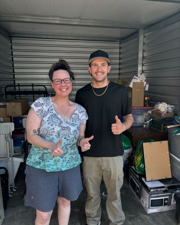Thumbs Up Moving Labor team helping a customer with storage unit moving near me, safe and reliable storage movers handling boxes and furniture.