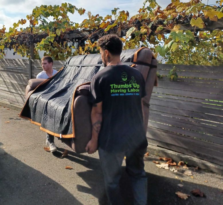 expert movers lifting heavy furniture for safe nonprofit loading and unloading