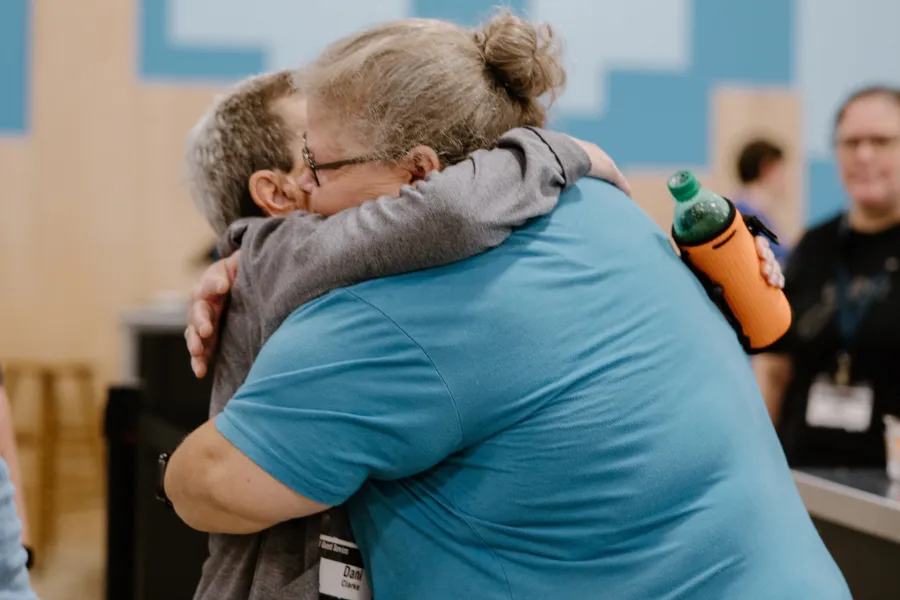 Man raising his hand for a prayer request
