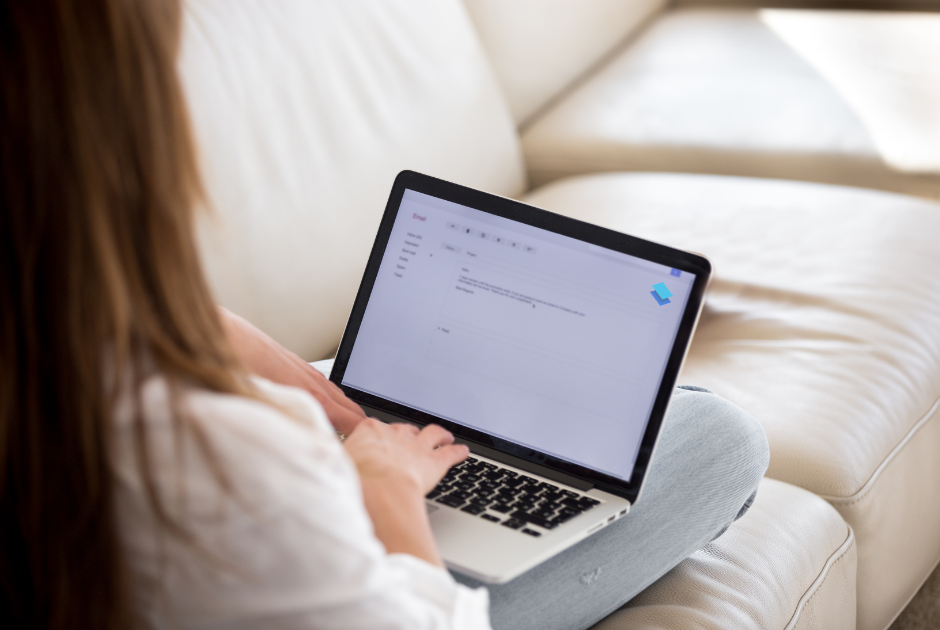 A lawyer working at their desk, drafting an email or personal note to a client