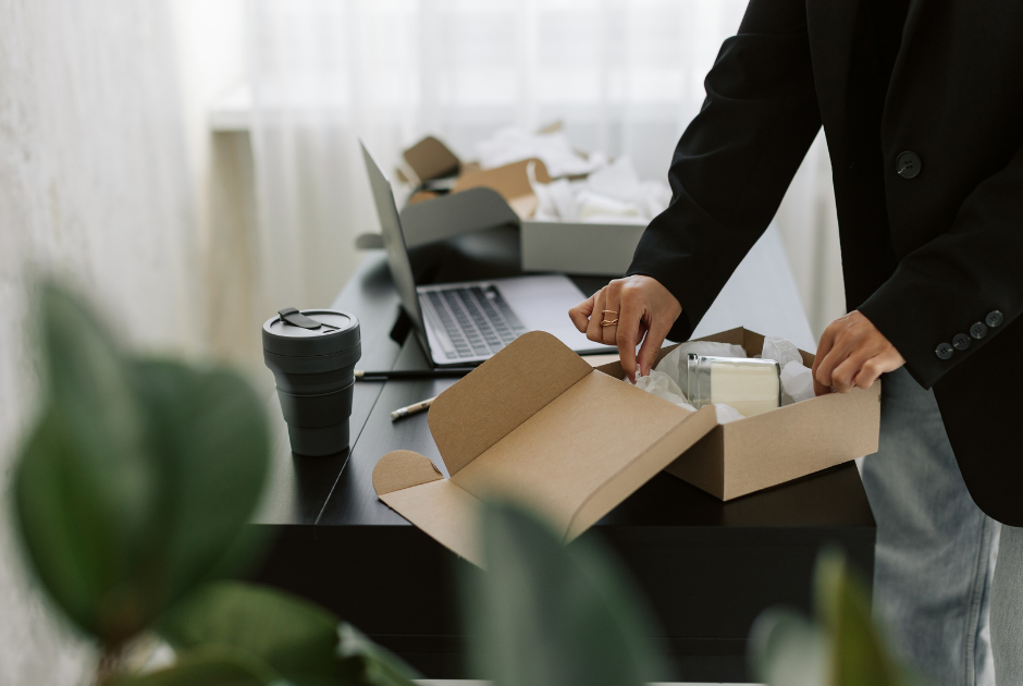Loyal customer opening a package sent by their insurance agent to celebrate a customer milestone