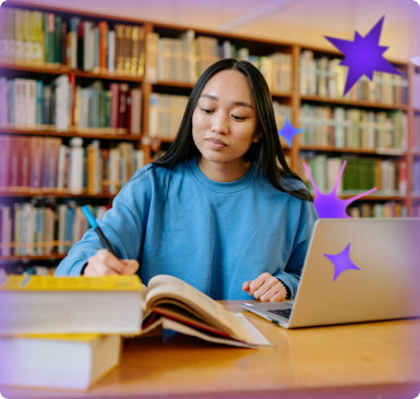 Student studying at a library table, reading a book and taking notes beside a laptop, with bookshelves in the background and subtle star graphics suggesting focus and learning support.