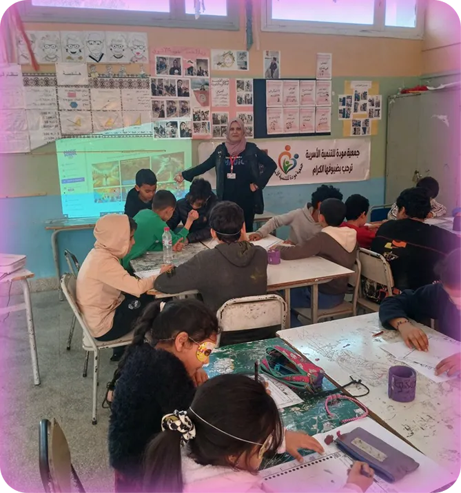 Teacher standing in front of her classroom pointing to a projector screen with MagicSchool on it.