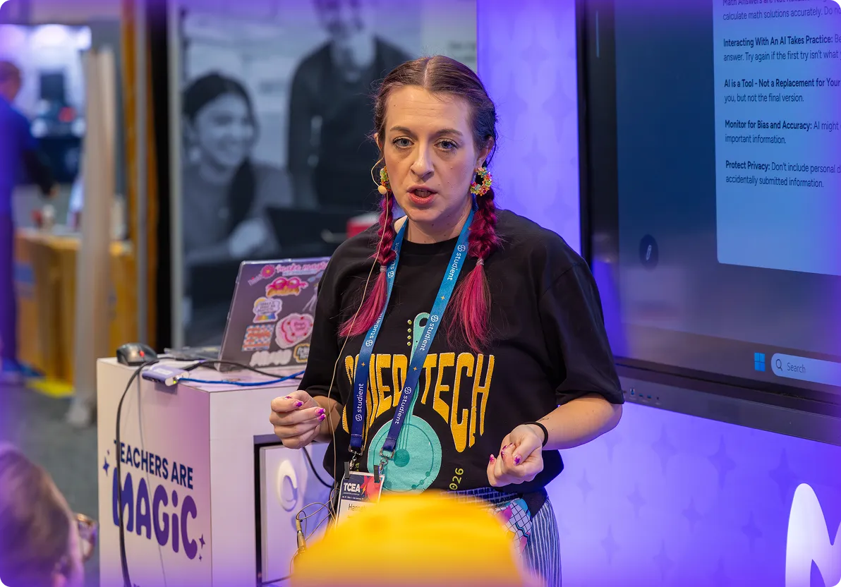 A female presenting at the MagicSchool trade show booth.