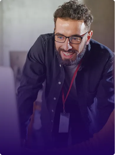 Image of chief technology officer looking over a computer screen.