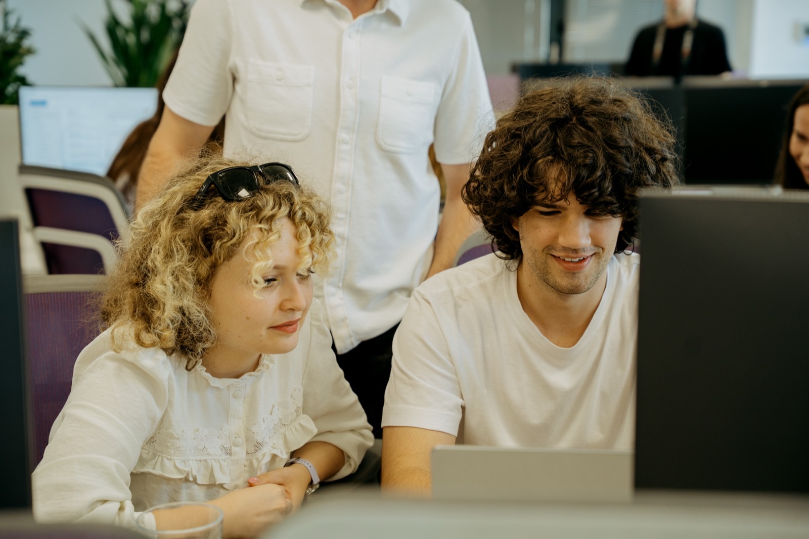 RebelDot team members working together at a laptop