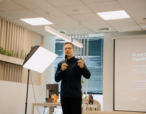 Speaker presenting AI and data capabilities