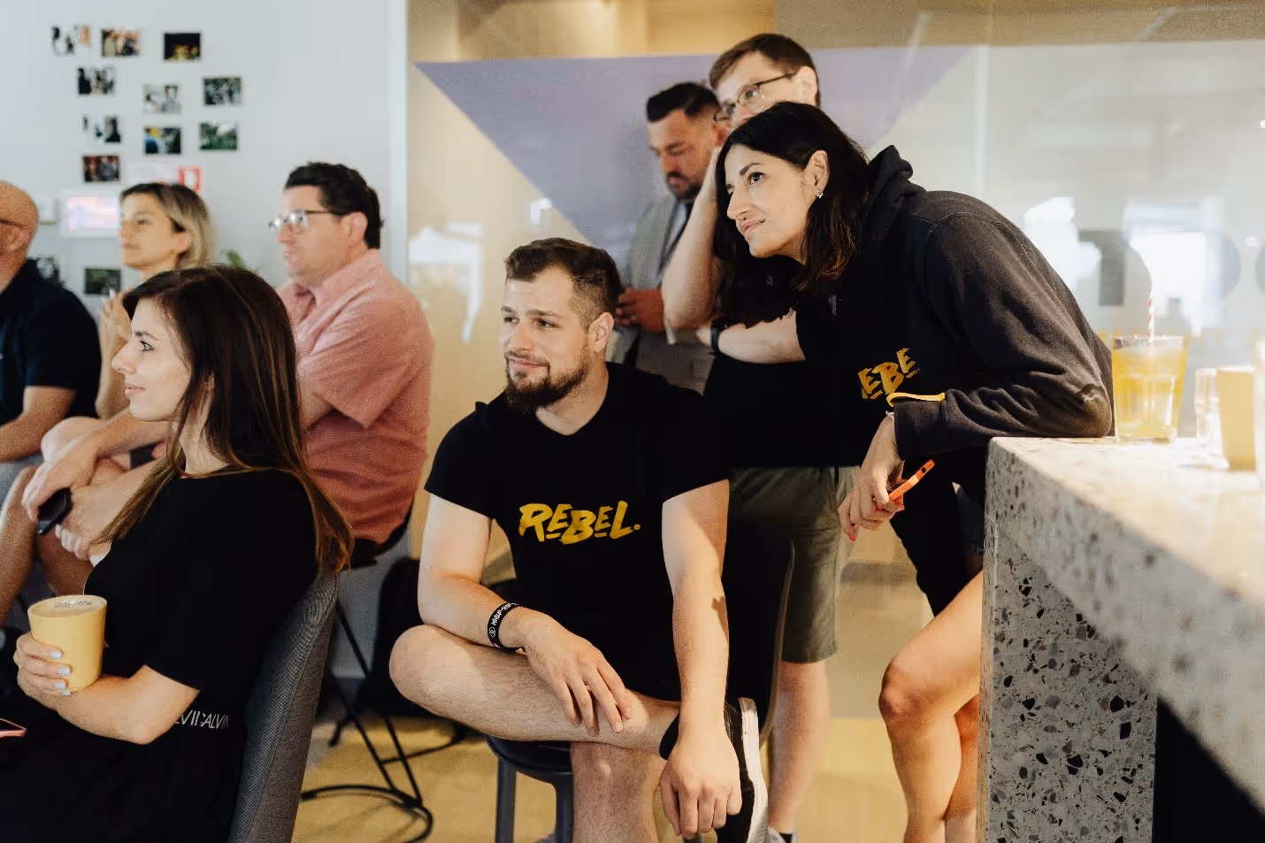 A group of people sitting in chairsDescription automatically generated