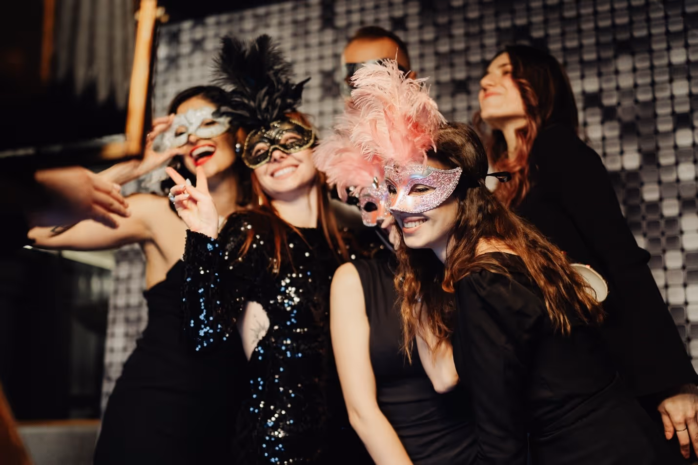 A group of women wearing masksDescription automatically generated
