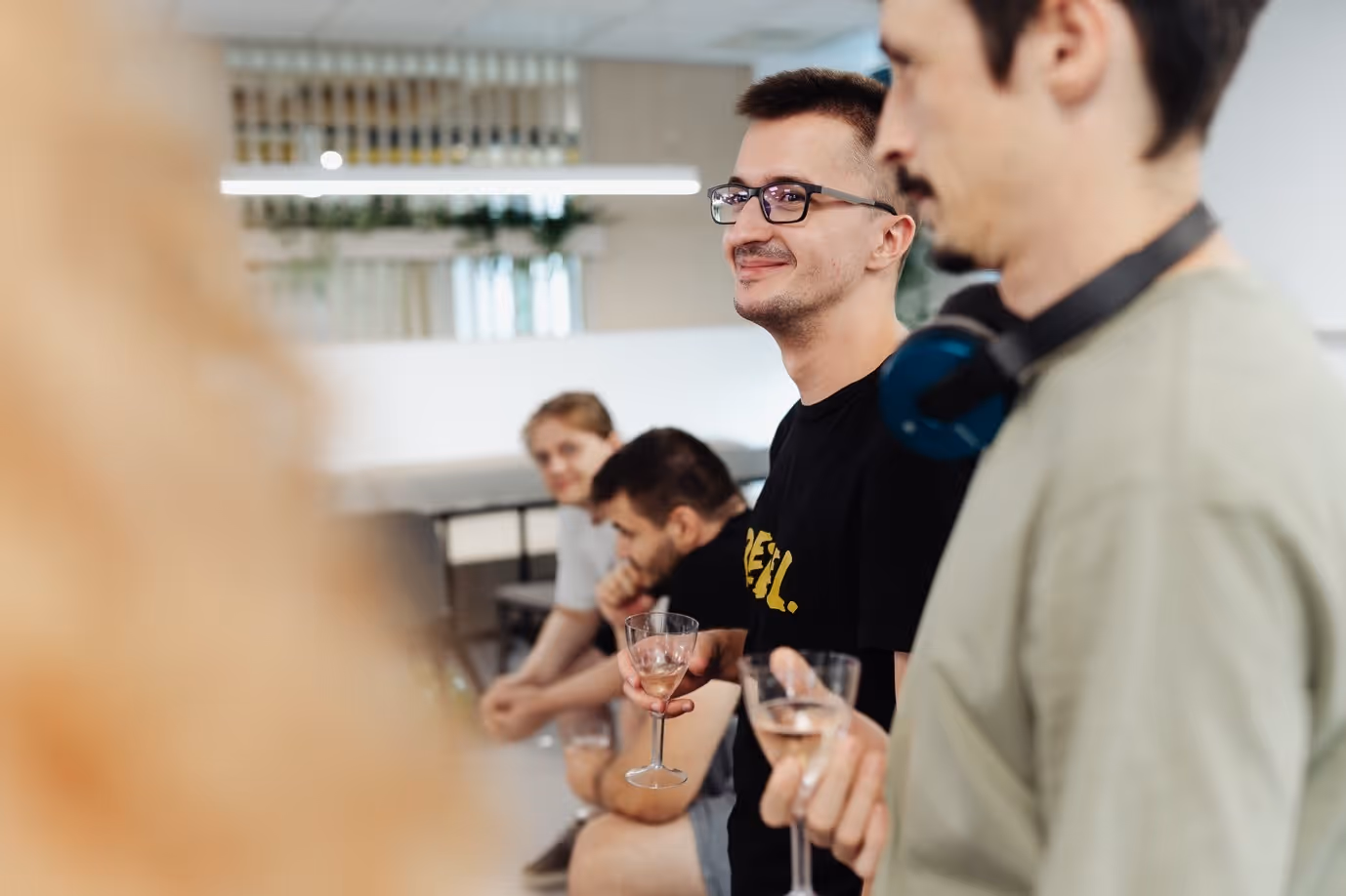 A group of people holding wine glassesAI-generated content may be incorrect., Picture