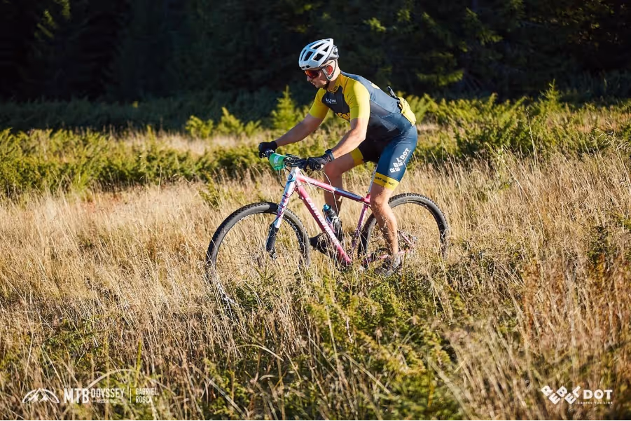 A person riding a bike in a fieldAI-generated content may be incorrect.