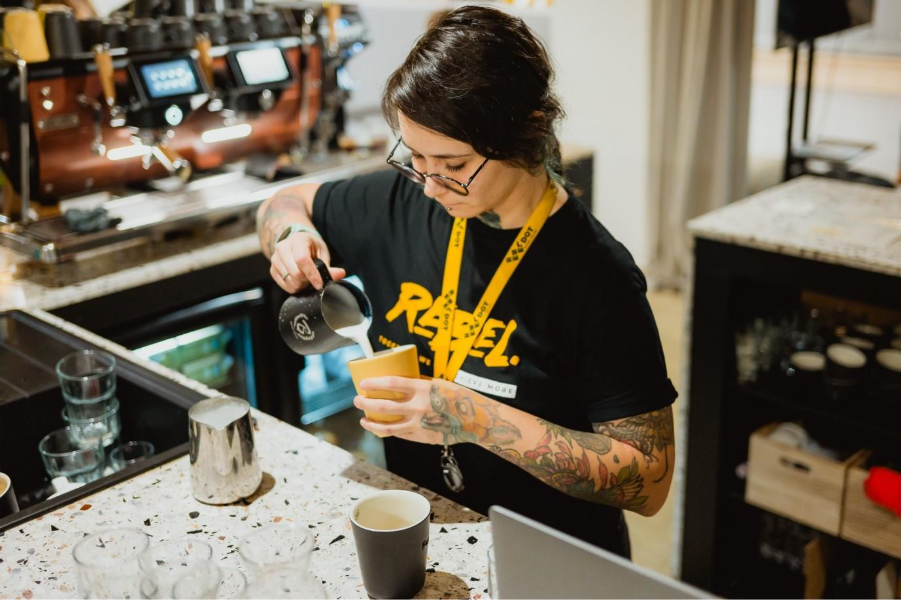 A person pouring milk into a cupAI-generated content may be incorrect.