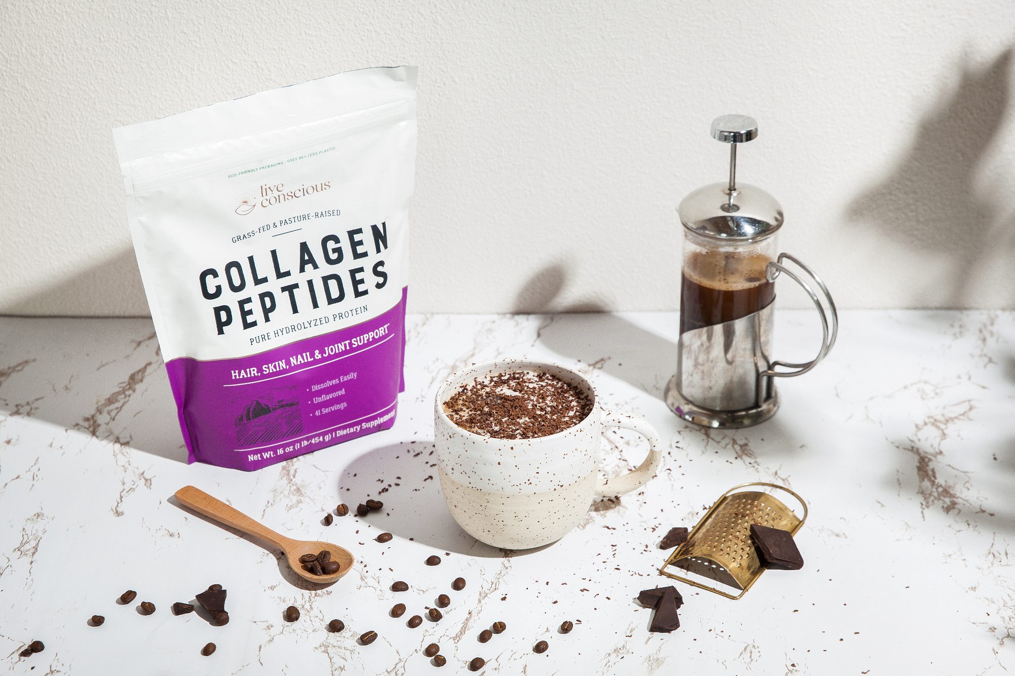 Collagen Peptides pouch beside a coffee and a French press