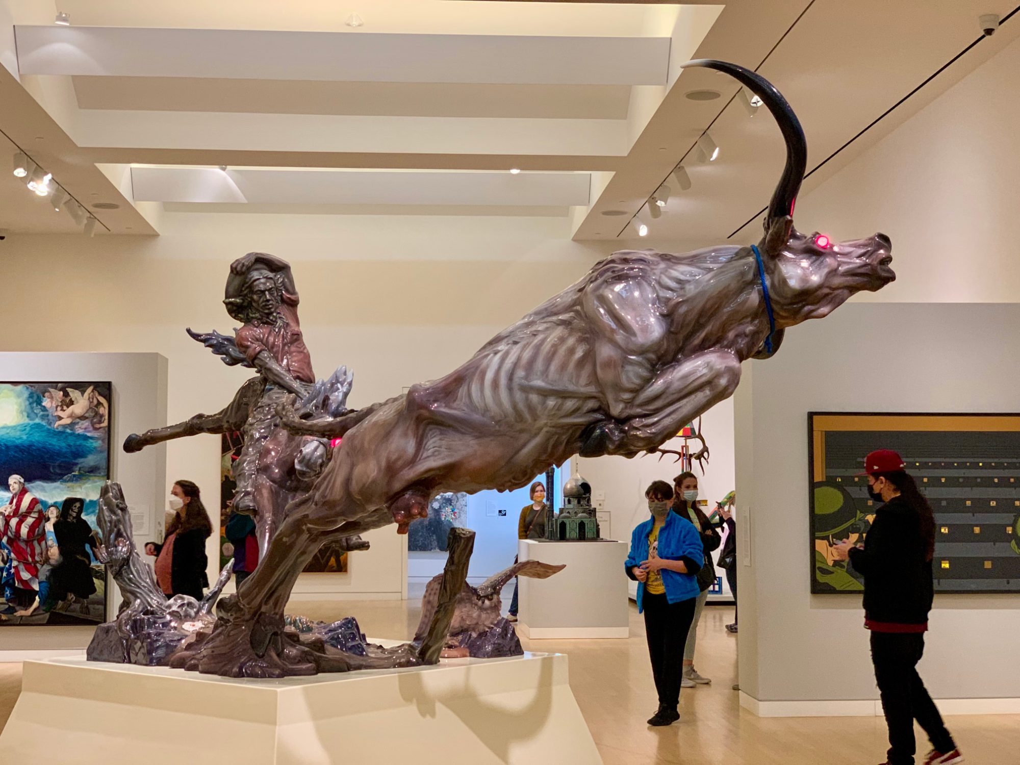 Luis Jiménez's Progress II, a large fiberglass sculpture of a leaping steer, in a Crocker Art Museum gallery with visitors standing nearby