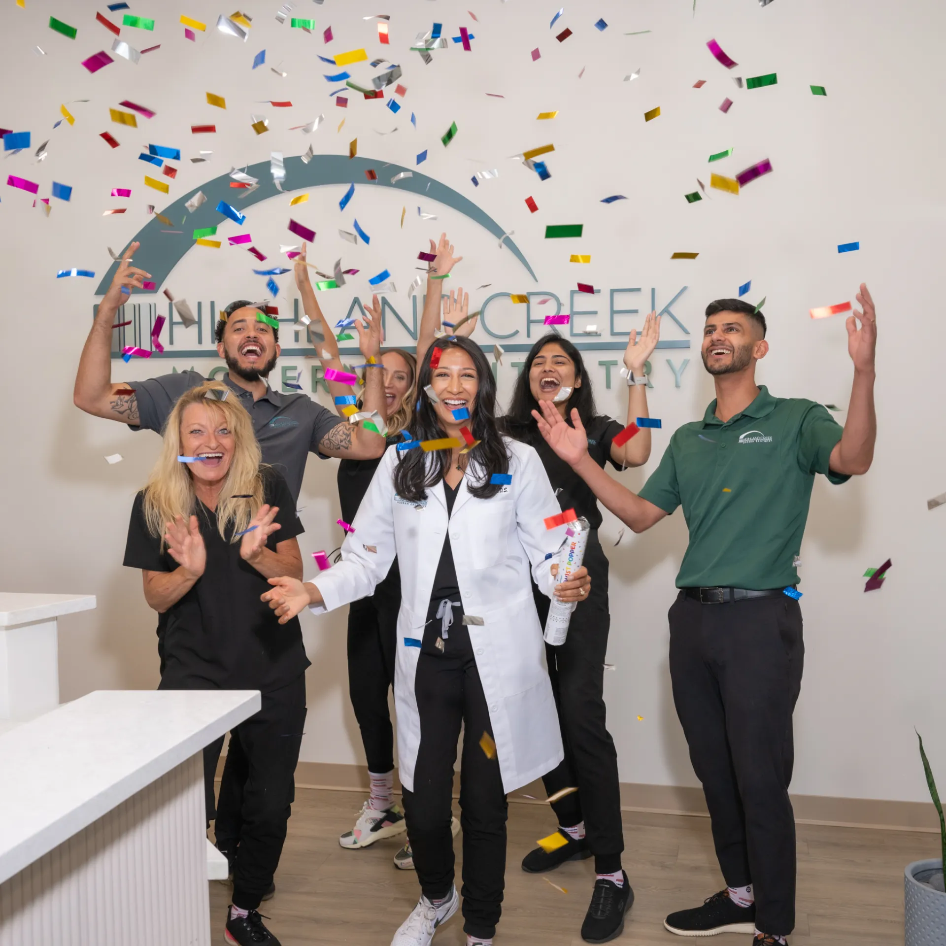 Higland Creek Modern Dentistry team celebrating