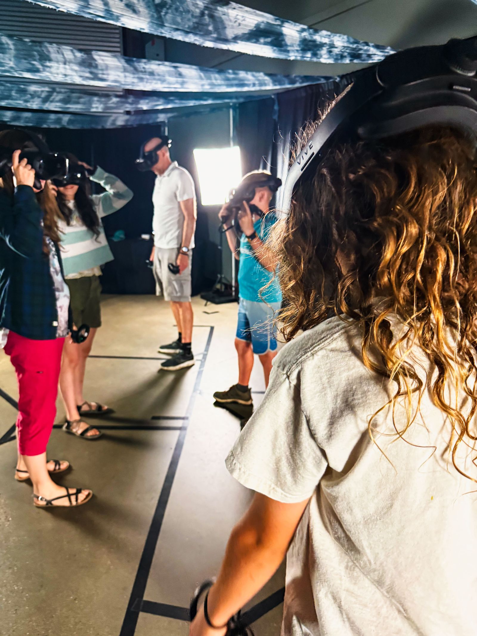 In-experience view of Step Into Webb showing explorers floating beside the Pillars of Creation