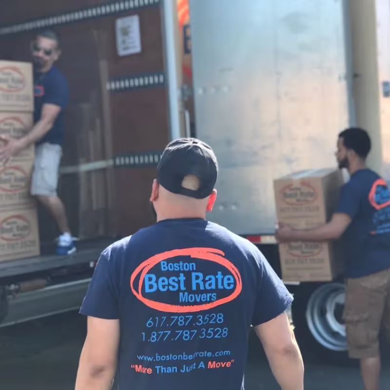 Boston movers carefully handling household furniture