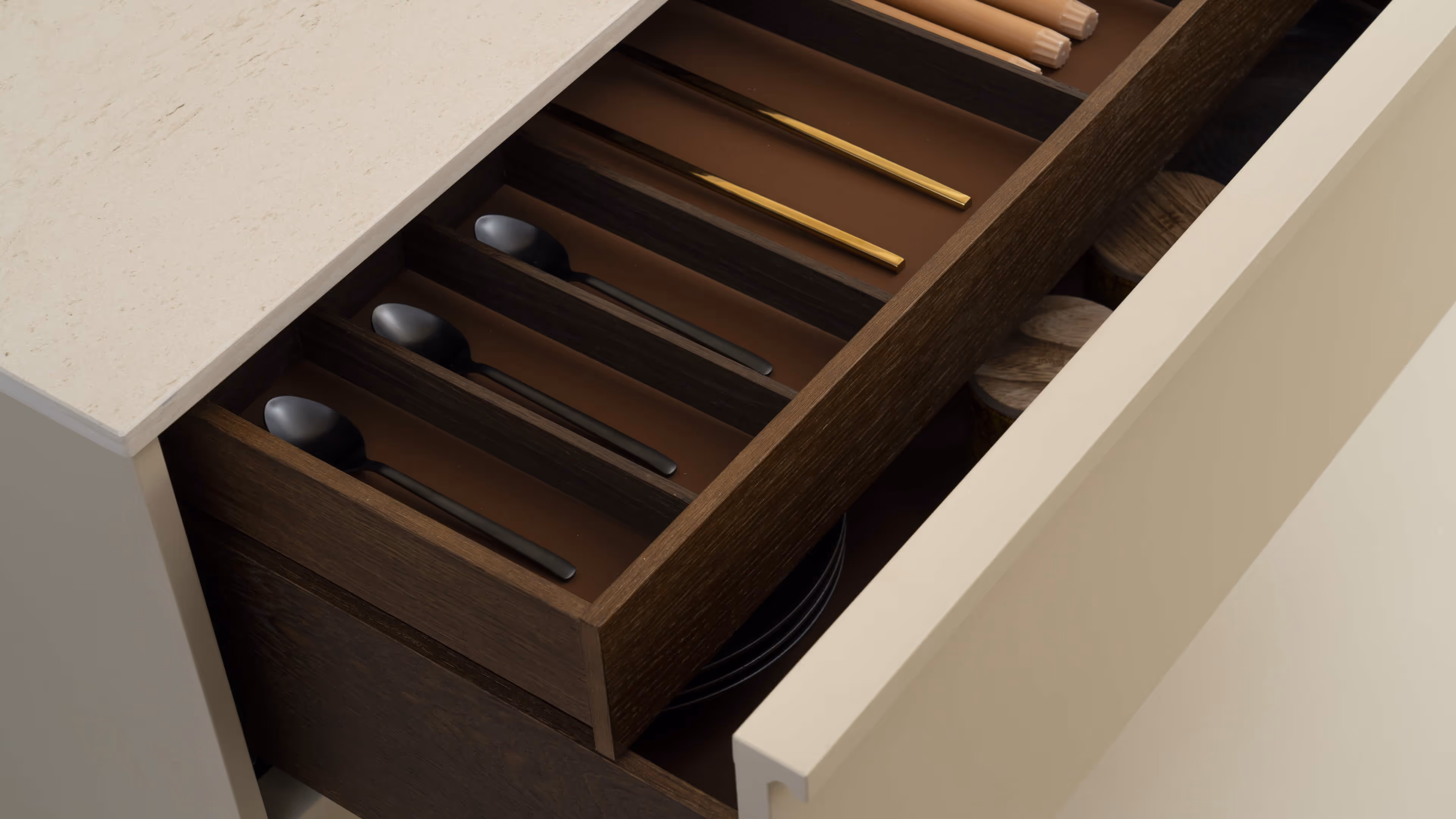A kitchen drawer with utensils