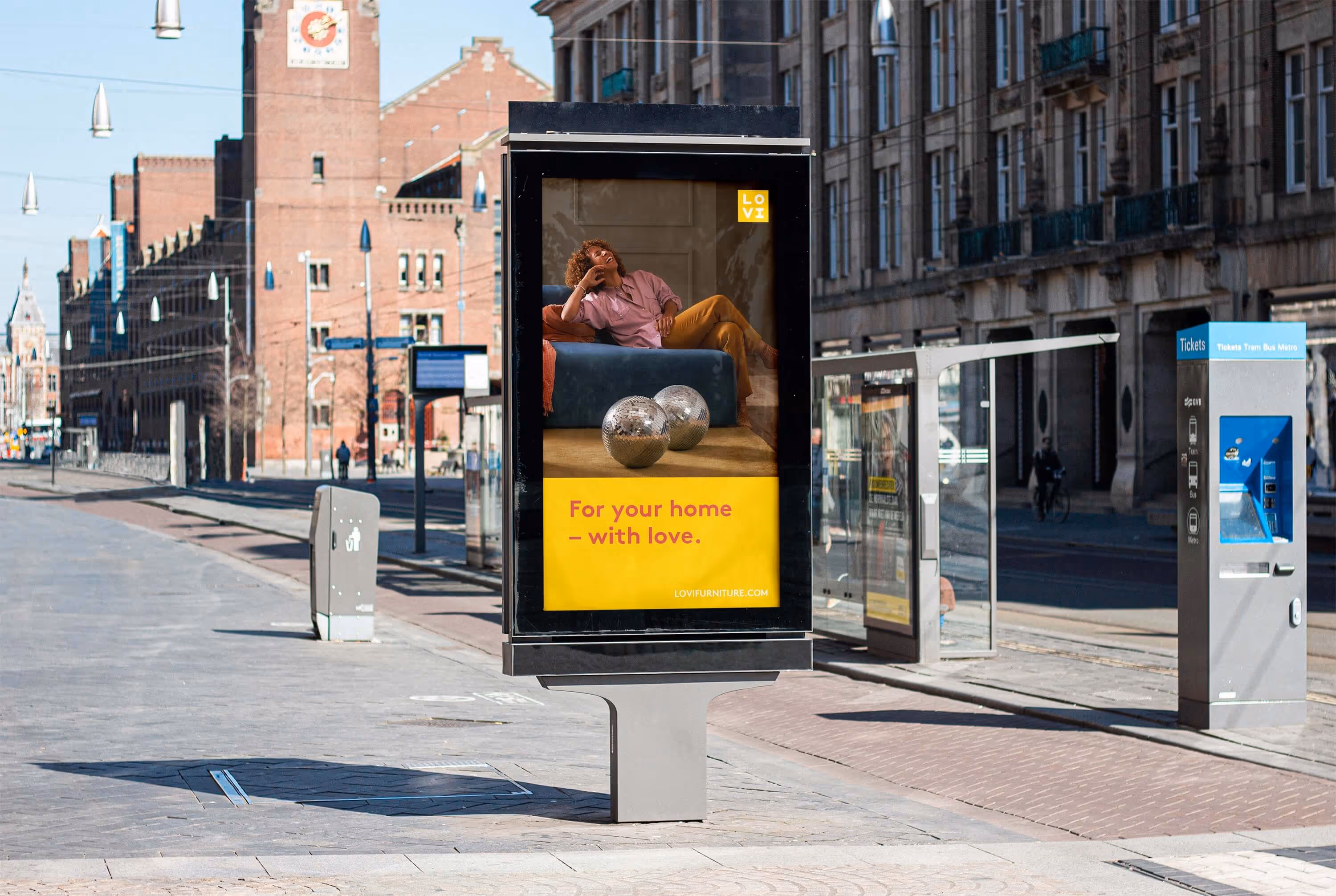 A ad sign on a busstop with an ad from LOVI