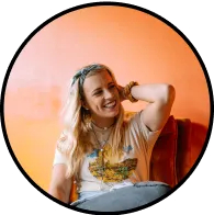 Woman smiling, orange background