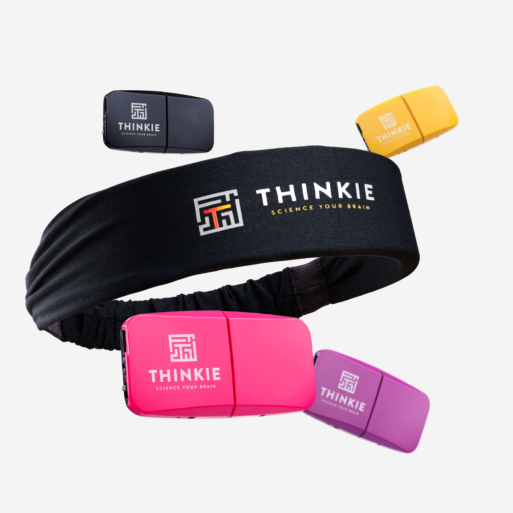 Black Thinkie headband surrounded by pink, yellow, black, and purple sensors