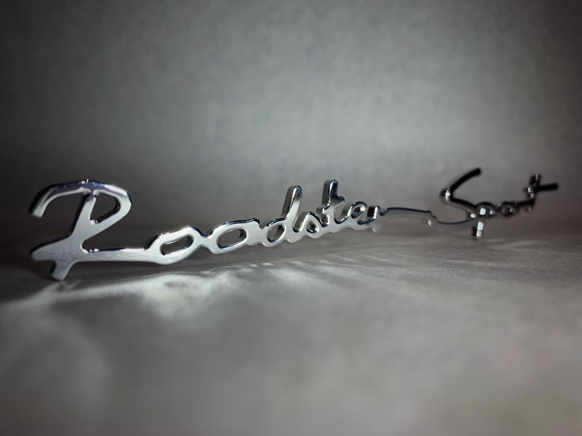 Roadster Sport Rear Bumper Badge