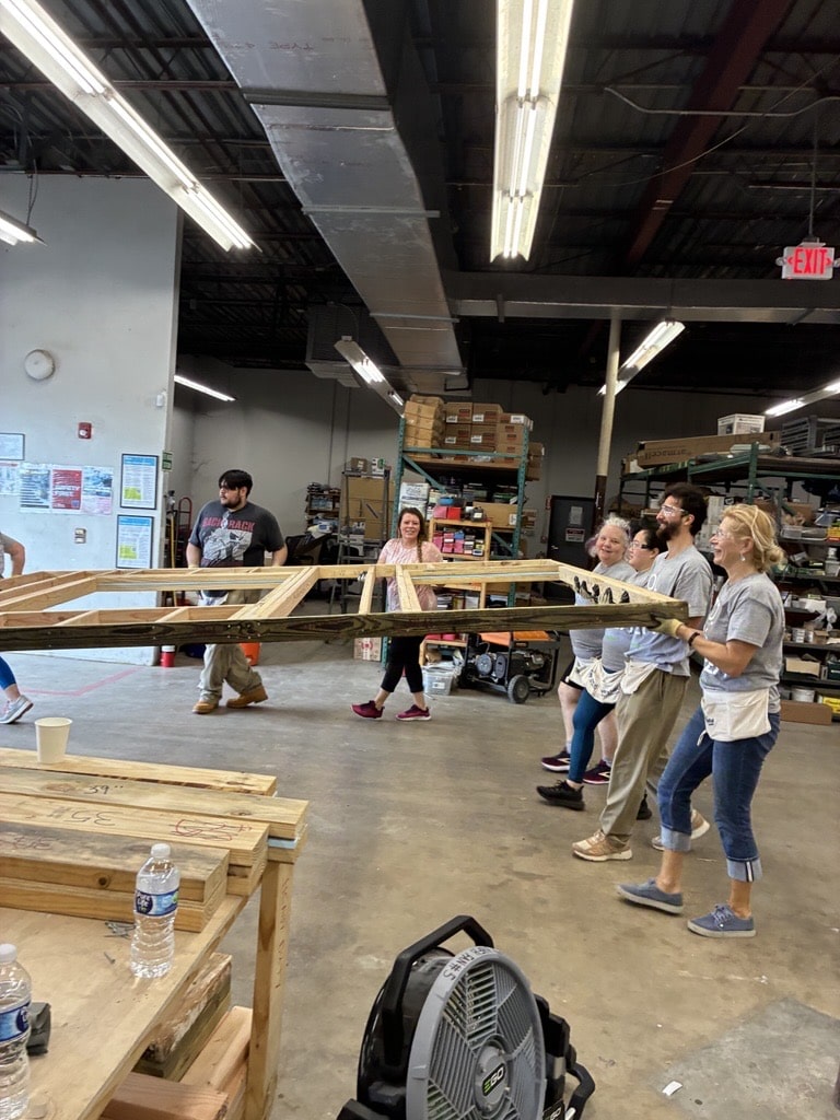 Gexa volunteers working on home frame