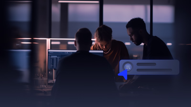 Three people collaborating around a computer in a dimly lit office with a digital interface overlay.