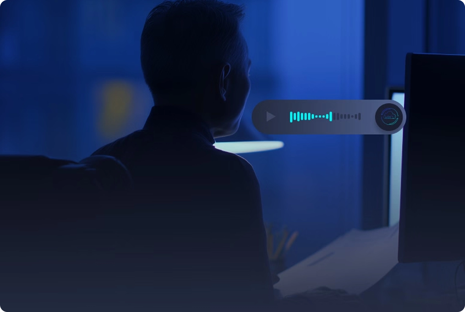 Person in dark room facing a computer screen with a floating audio waveform graphic beside them.