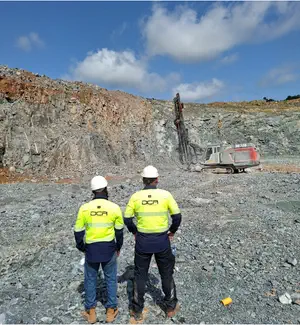 DCA team monitoring drilling at an open pit mine