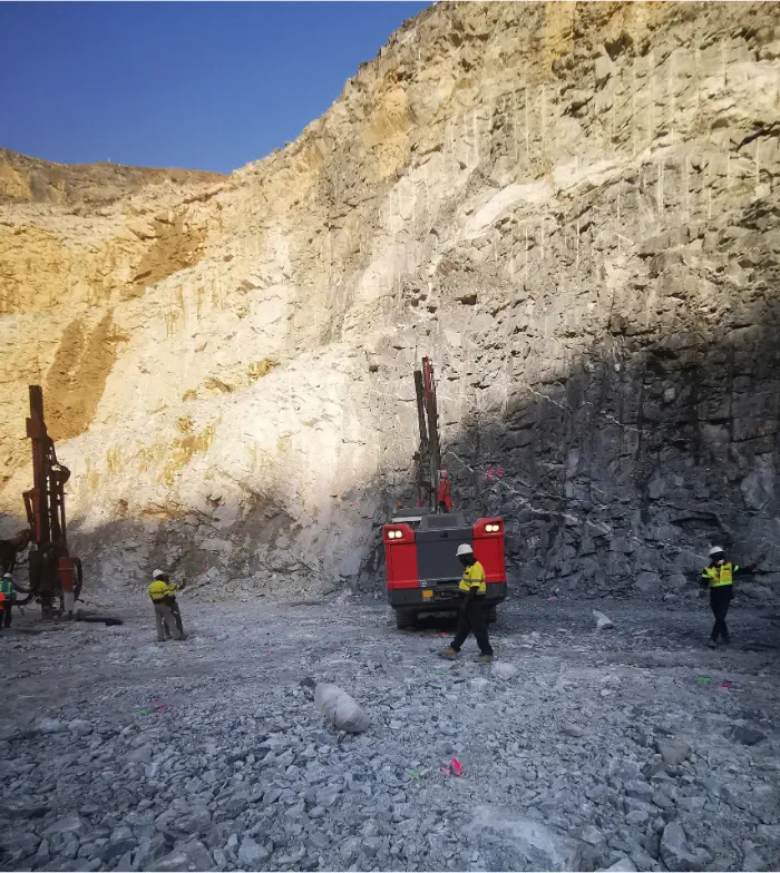 Sandvik DPi drill rigs and DCA team at Rocksure International's open pit mine in Ghana