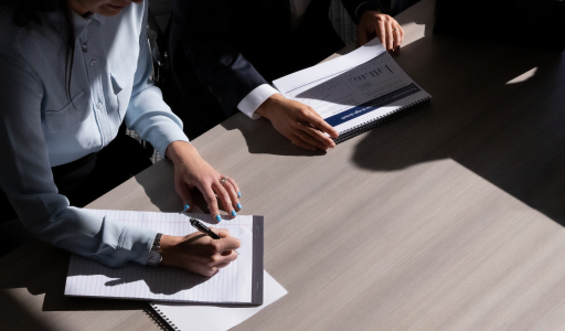 A group of business people sitting around a conference table