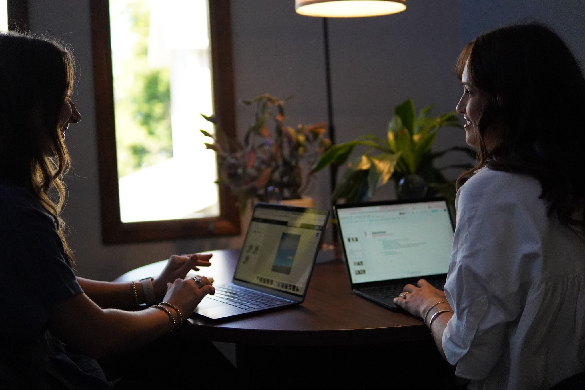 Jasmine and Lily working at a desk
