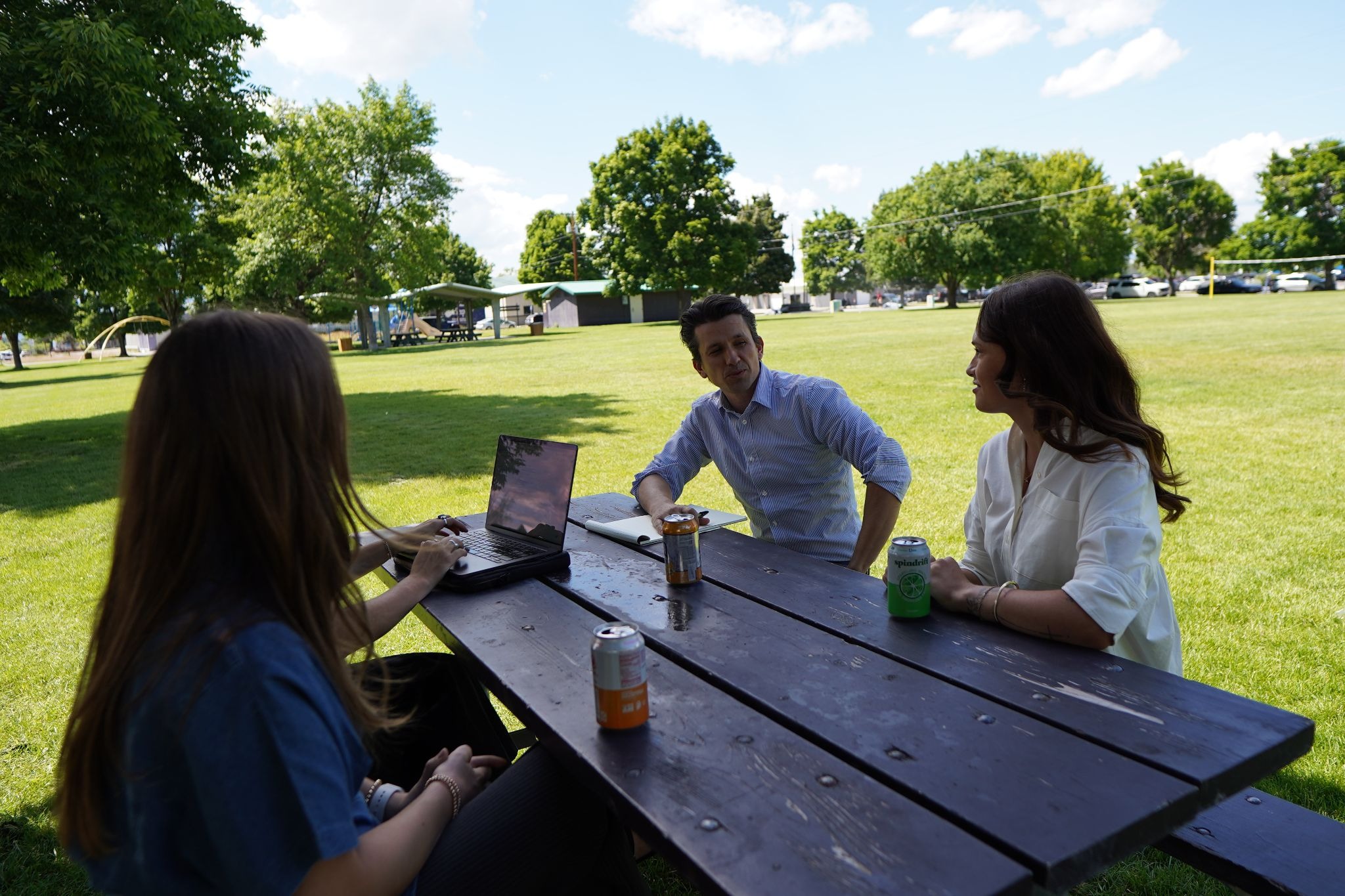 Team talking geo personalization on a picnic bench