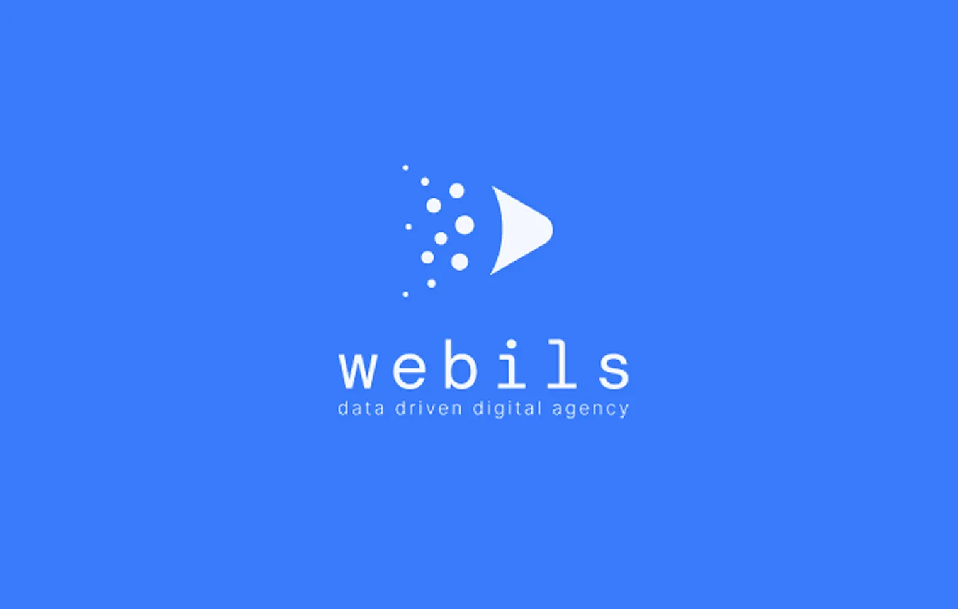 White logo on blue background featuring a right-pointing triangular shape with scattered dots to the left, above the text 'webils' and the tagline 'data driven digital agency'.