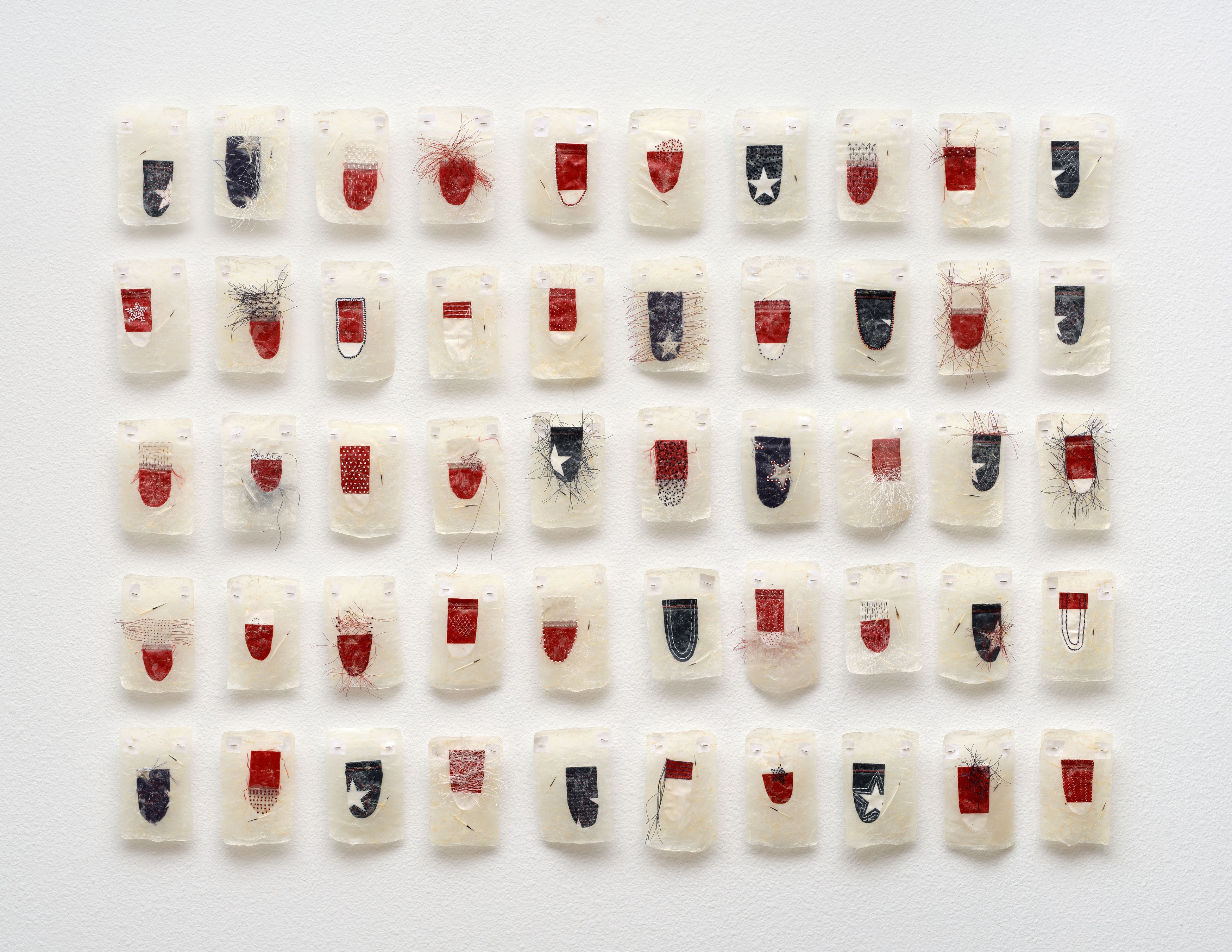Red, White and Blue Buried Secret Portraits, 2023, Acrylic polymer, hog gut, nylon thread, glass bands, porcupine quills, nylon fabric, steel pins, dimensions variable. Tia Collection, Sante Fe, NM