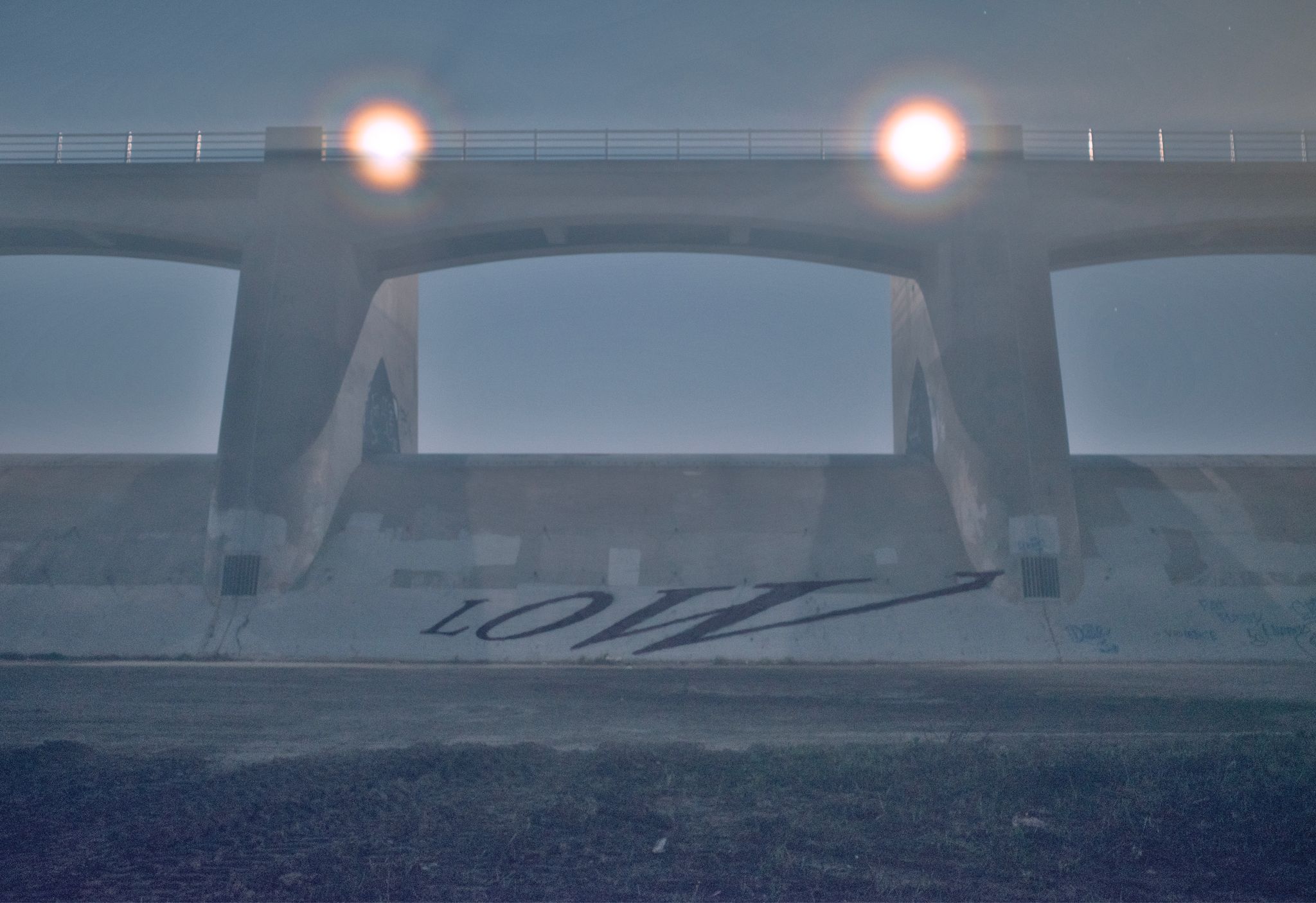 Low, 2024, Spray paint on cement