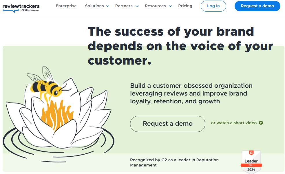 ReviewTrackers homepage with a customer-voice headline, review and analytics messaging, a Request a demo button, and a G2 Leader badge.