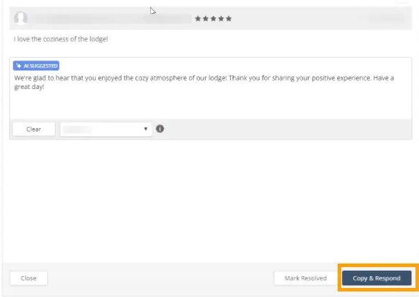 Five-star lodge review with an AI-suggested response thanking the guest for enjoying the cozy atmosphere and a highlighted Copy & Respond button.