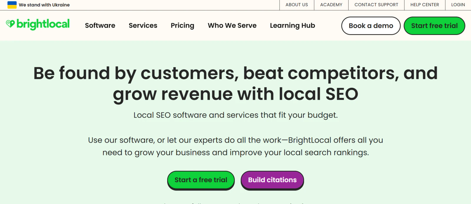 BrightLocal homepage with navigation, local SEO headline, and buttons for a free trial, demo, and citation building.