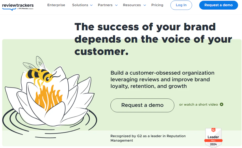 ReviewTrackers homepage with a customer-voice headline, review and analytics messaging, a Request a demo button, and a G2 Leader badge.