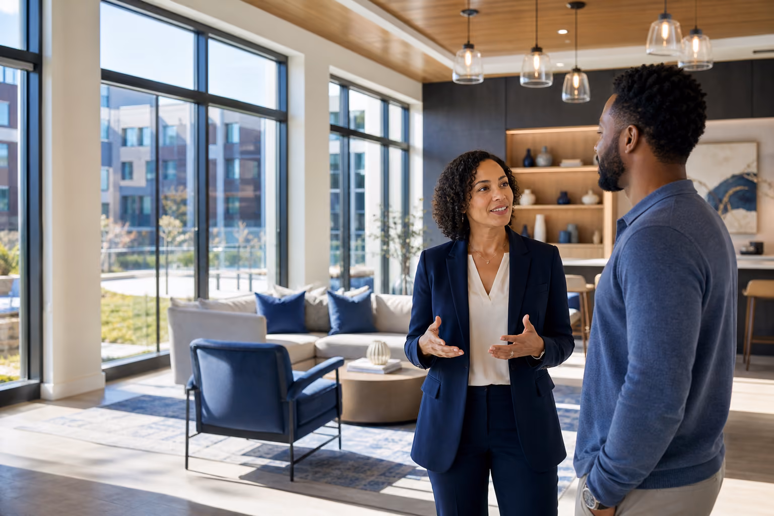 Property manager speaking with a resident in a modern apartment community