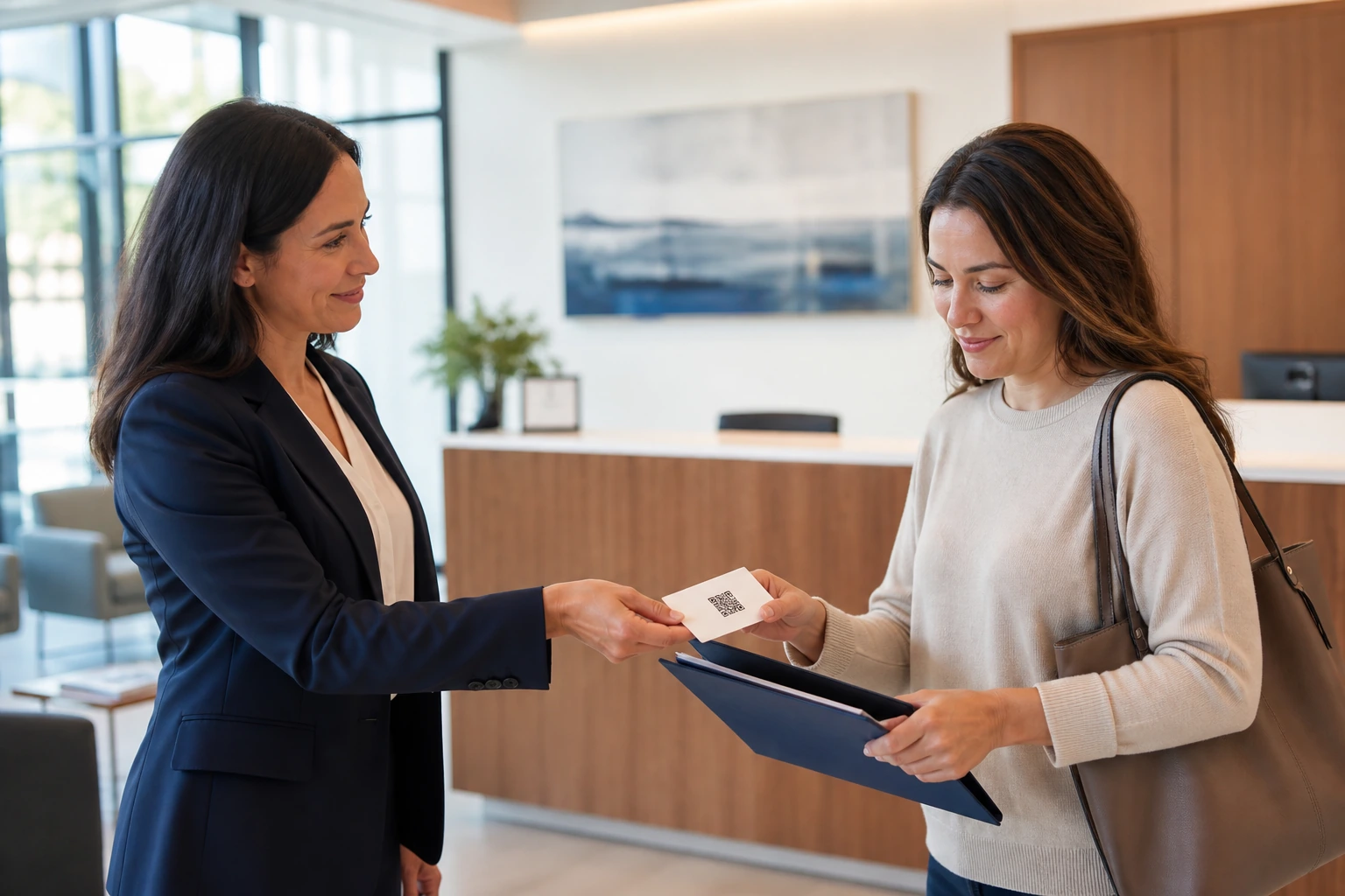 Law firm client care professional giving a client a take-home review QR card