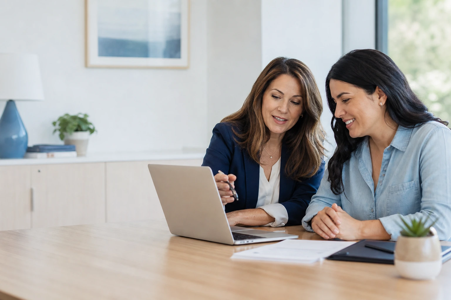 Accounting advisor explaining financial work clearly to a small-business owner in a modern office