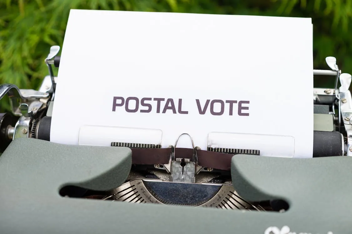 Free Paper With the Words Postal Vote in a Typewriter Stock Photo