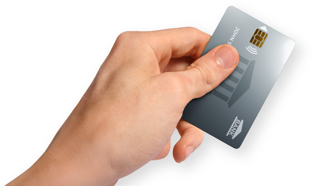 Hand holding a gray credit card with a chip and bank logo