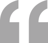 Graphic of large gray quotation marks.