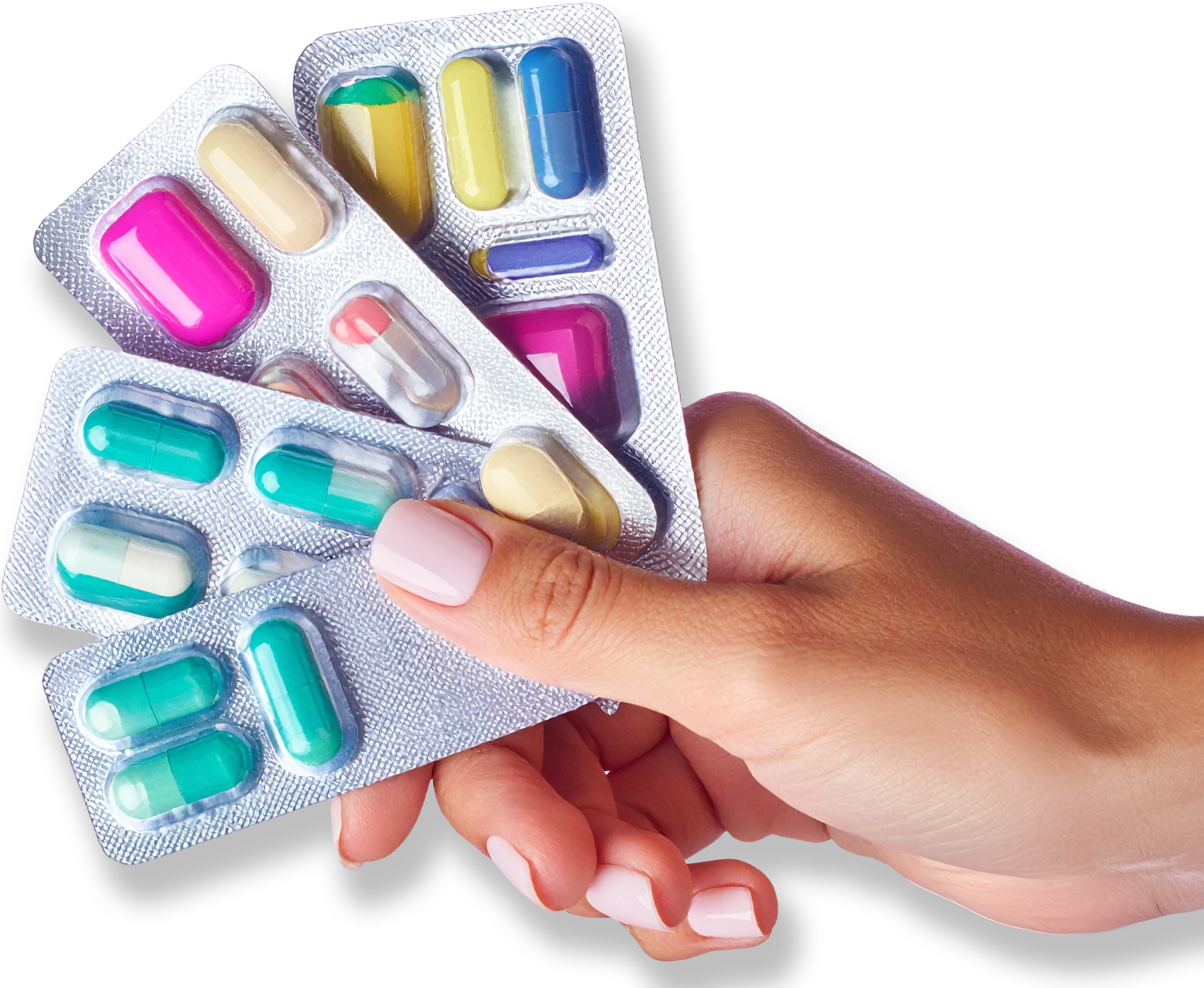 Hand holding multiple blister packs of various colored pills