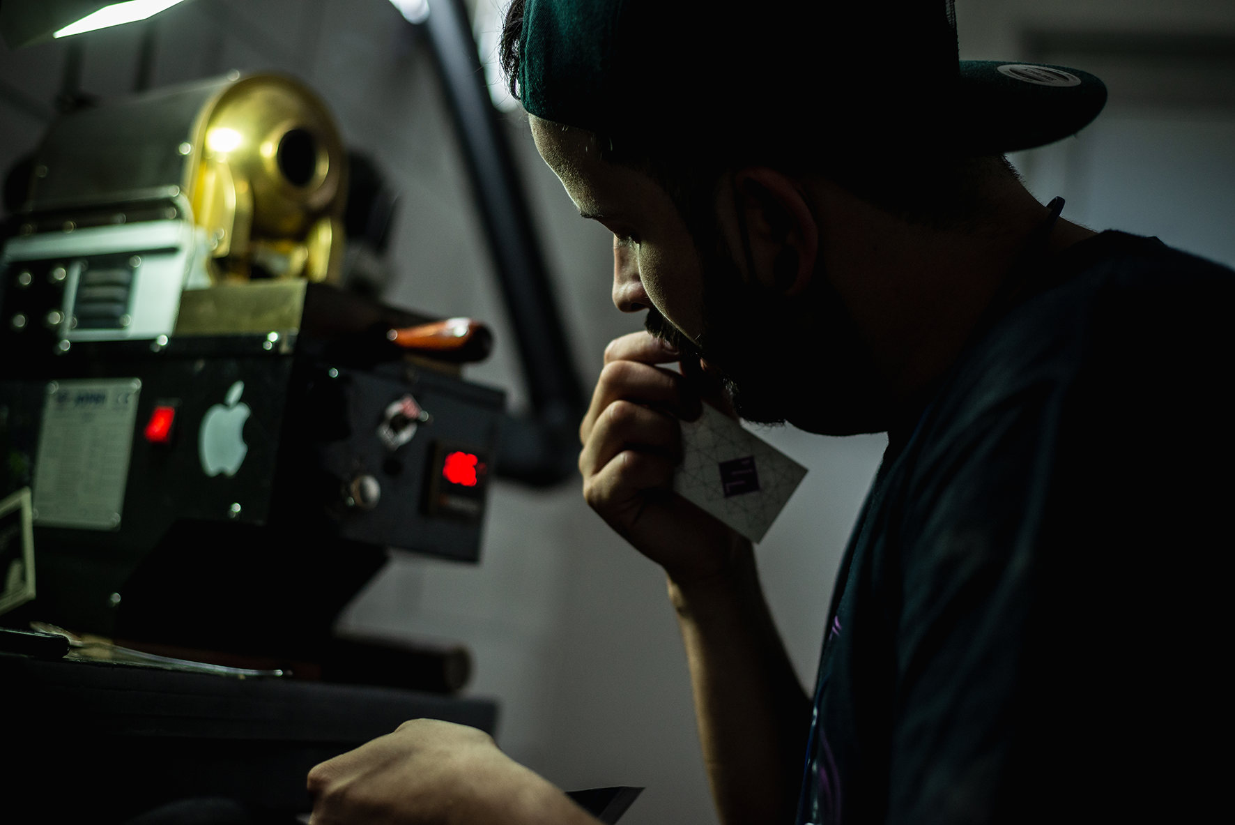 A coffee roaster in Colombia roasting coffee samples