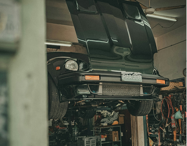 A European Lorry lifted on jacks in a mechanic garage